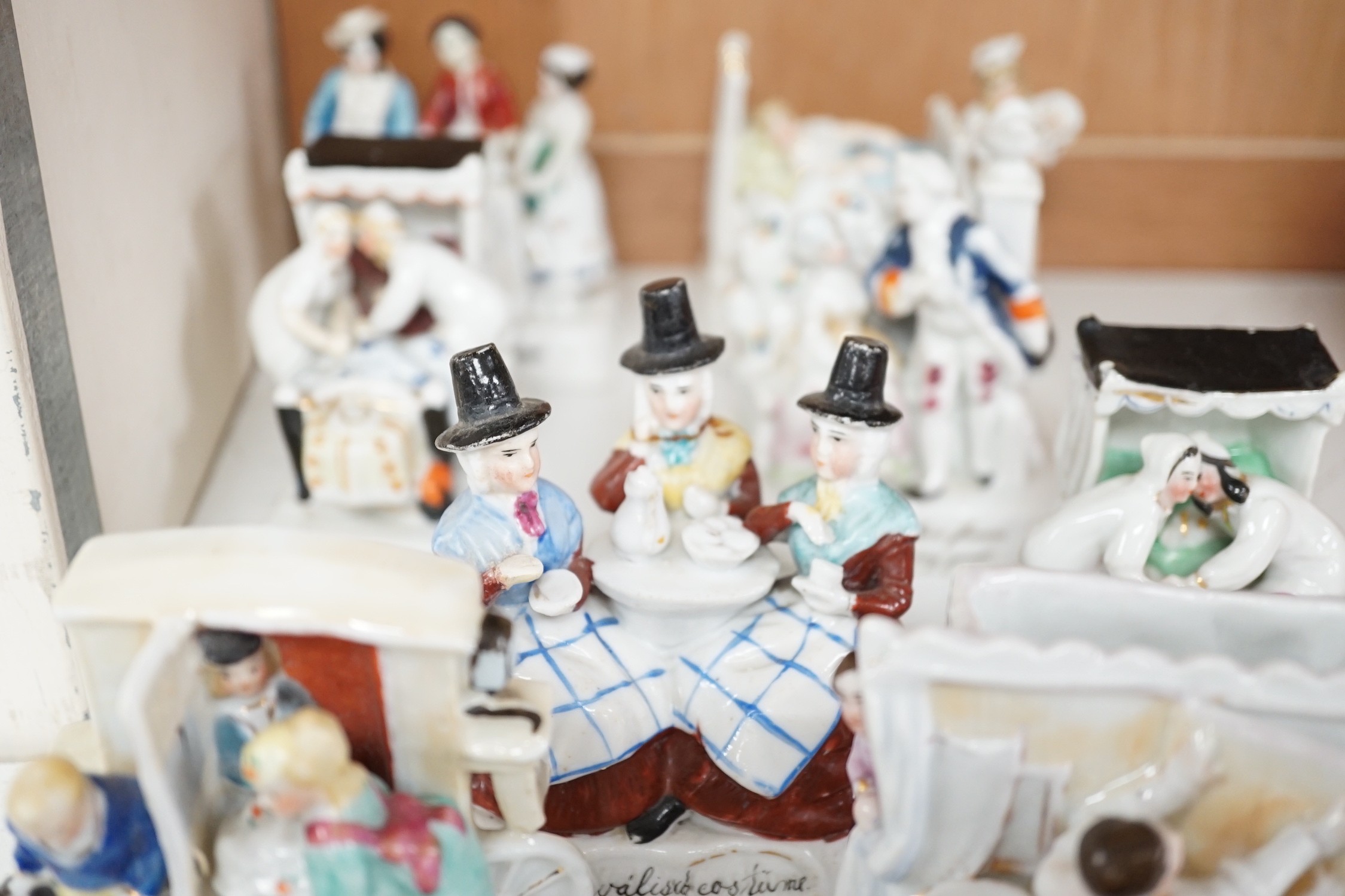 A collection of 14 German porcelain Fairings and a related book - Antiques collectors guide by Derek H. Jordan